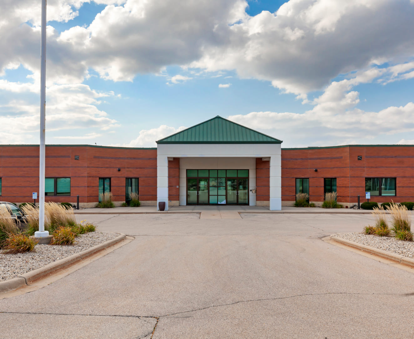 The front entrance of the one-story office building at 2601 Crossroads Drive in Madison, WI.