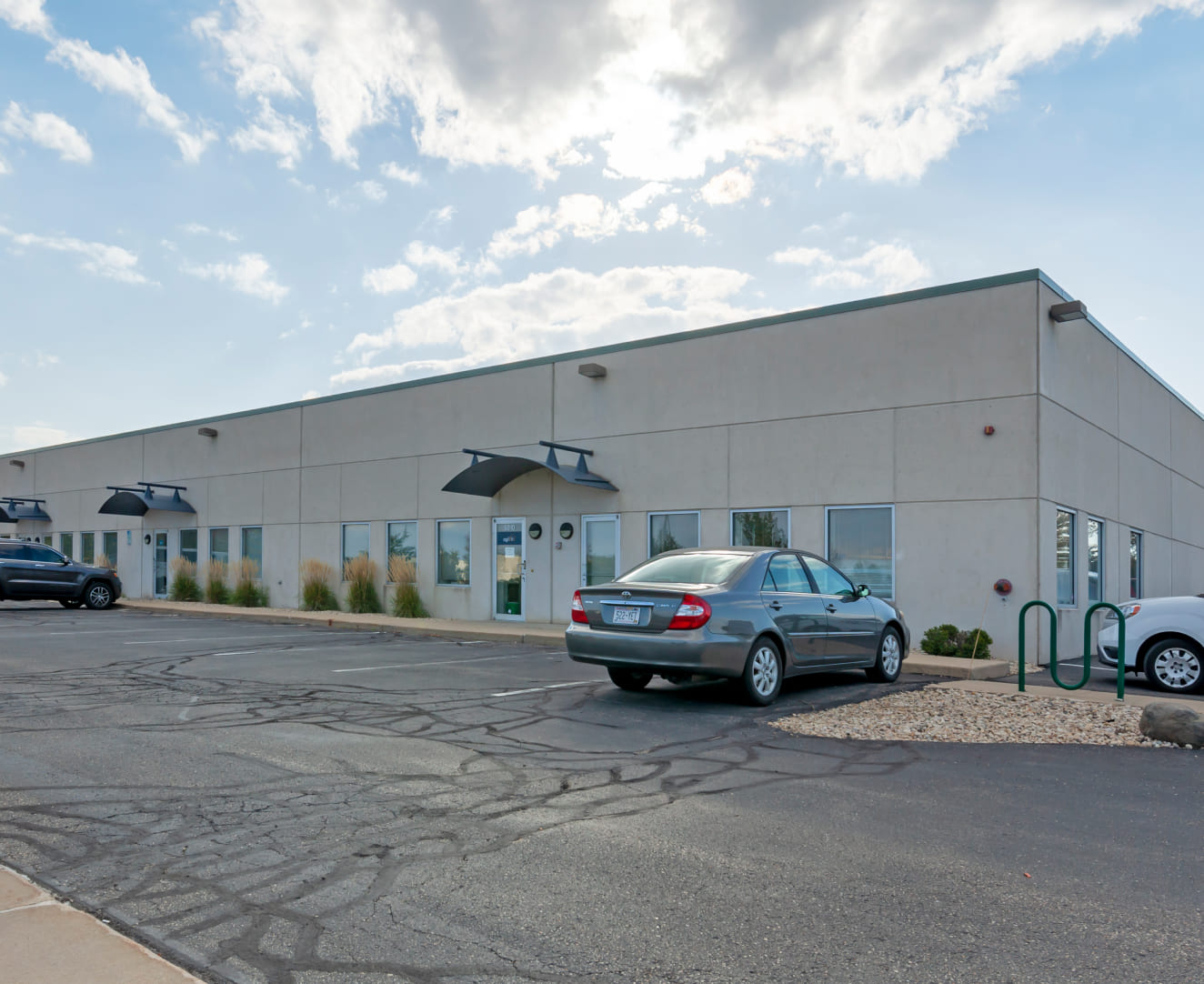 The parking lot and entrance at 5802-5820 Manufacturers Drive in Madison, WI.