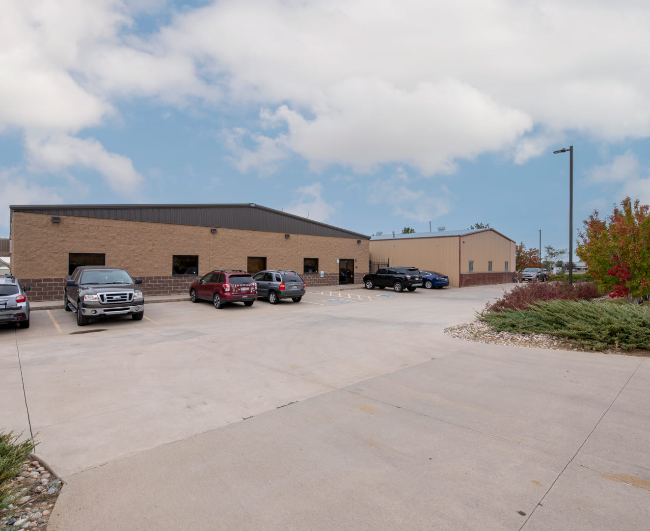 The parking lot and main entrance to the industrial property located at 599 71st Street in Loveland, CO.