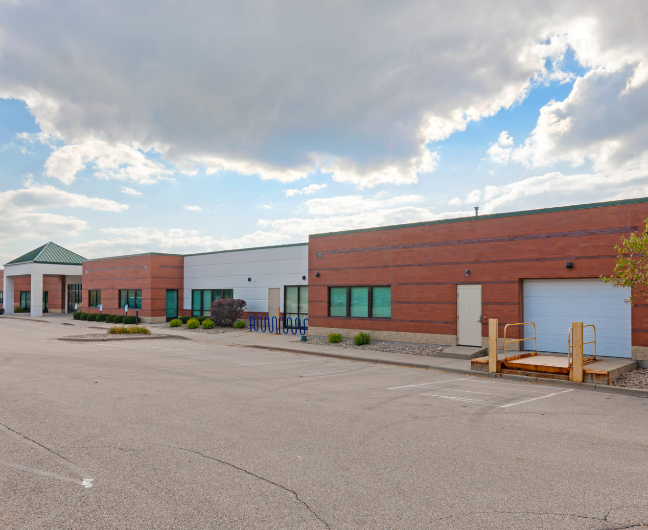 A rightside view of the parking lot and office building at 2601 Crossroads Drive in Madison, WI.