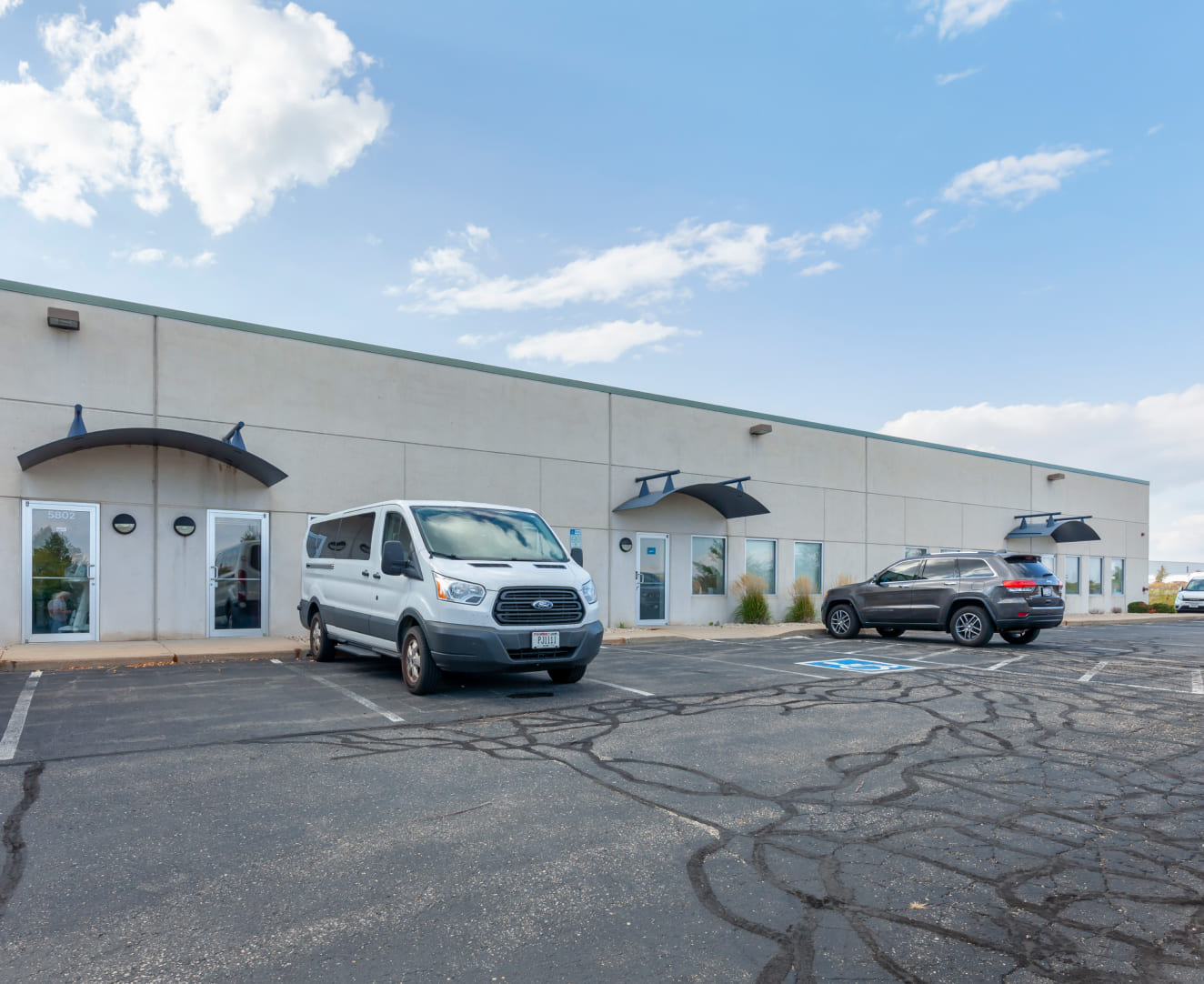 Another view of the parking lot and entrance at 5802-5820 Manufacturers Drive in Madison, WI.