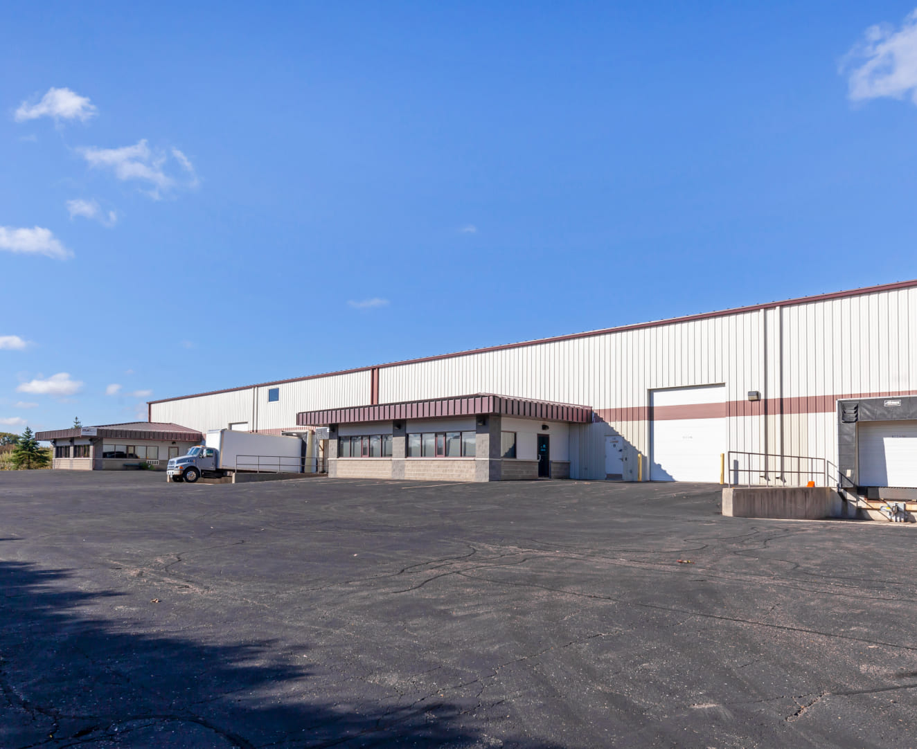 The back lot and loading docks of 8155 Forsythia Street in Middletown, WI.