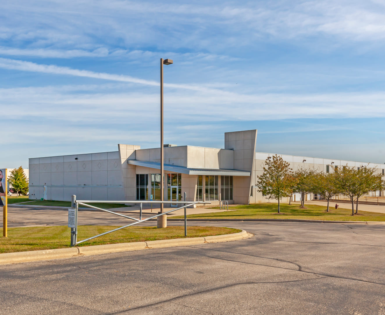 A view from the street of the parking lot and entrance at 5601 Manufacturers Drive in Madison, WI.