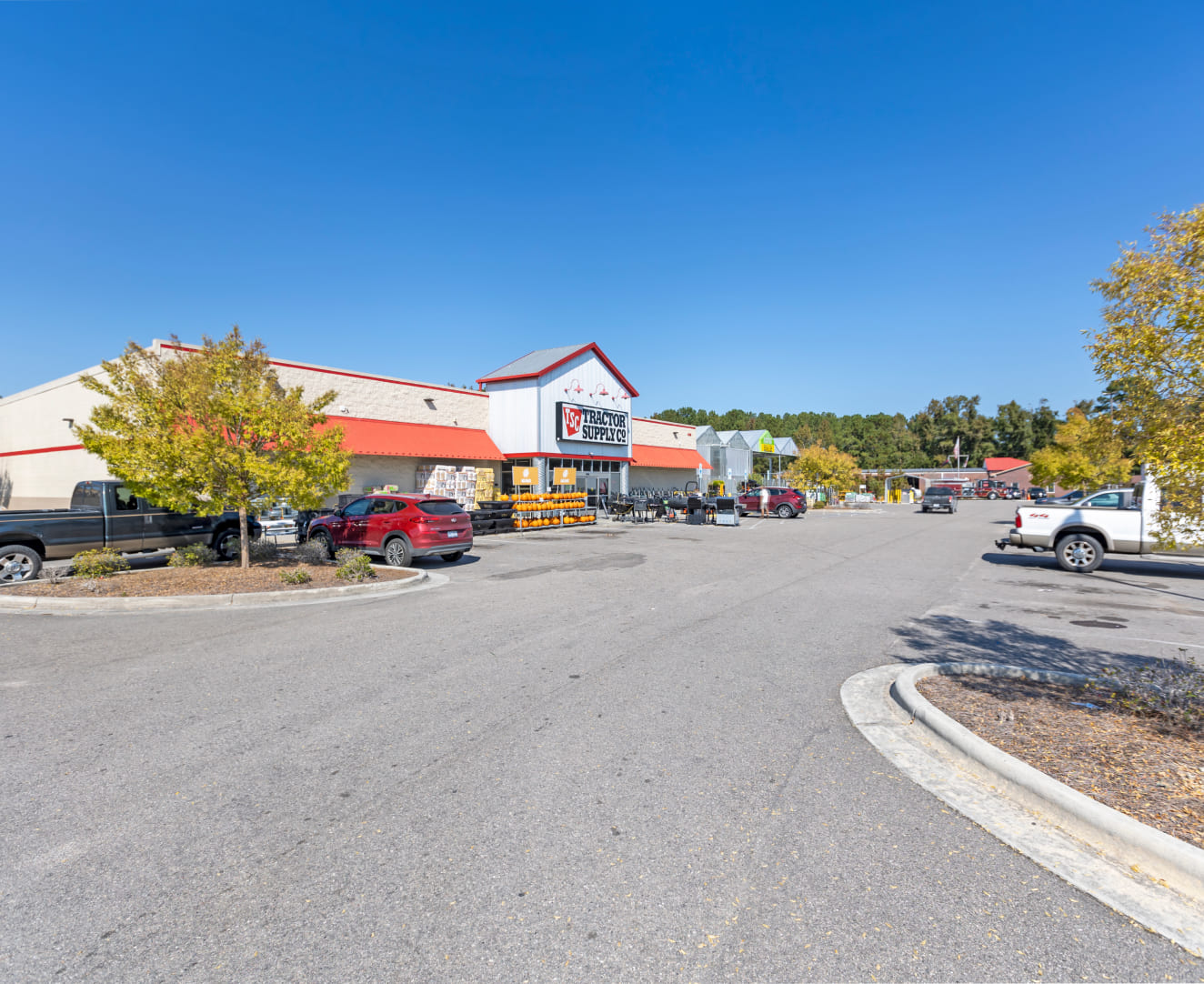 The left side of Tractor Supply Company at 7965 US Highway 117 in Rocky Point, NC. The parking lot is visable.