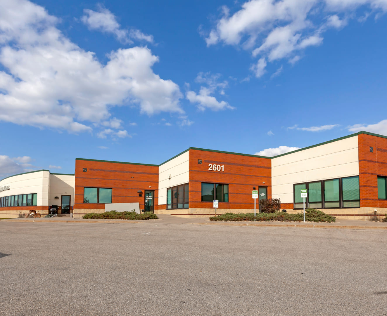 Another view of the parking lot and office building at 2601 Crossroads Drive in Madison, WI.
